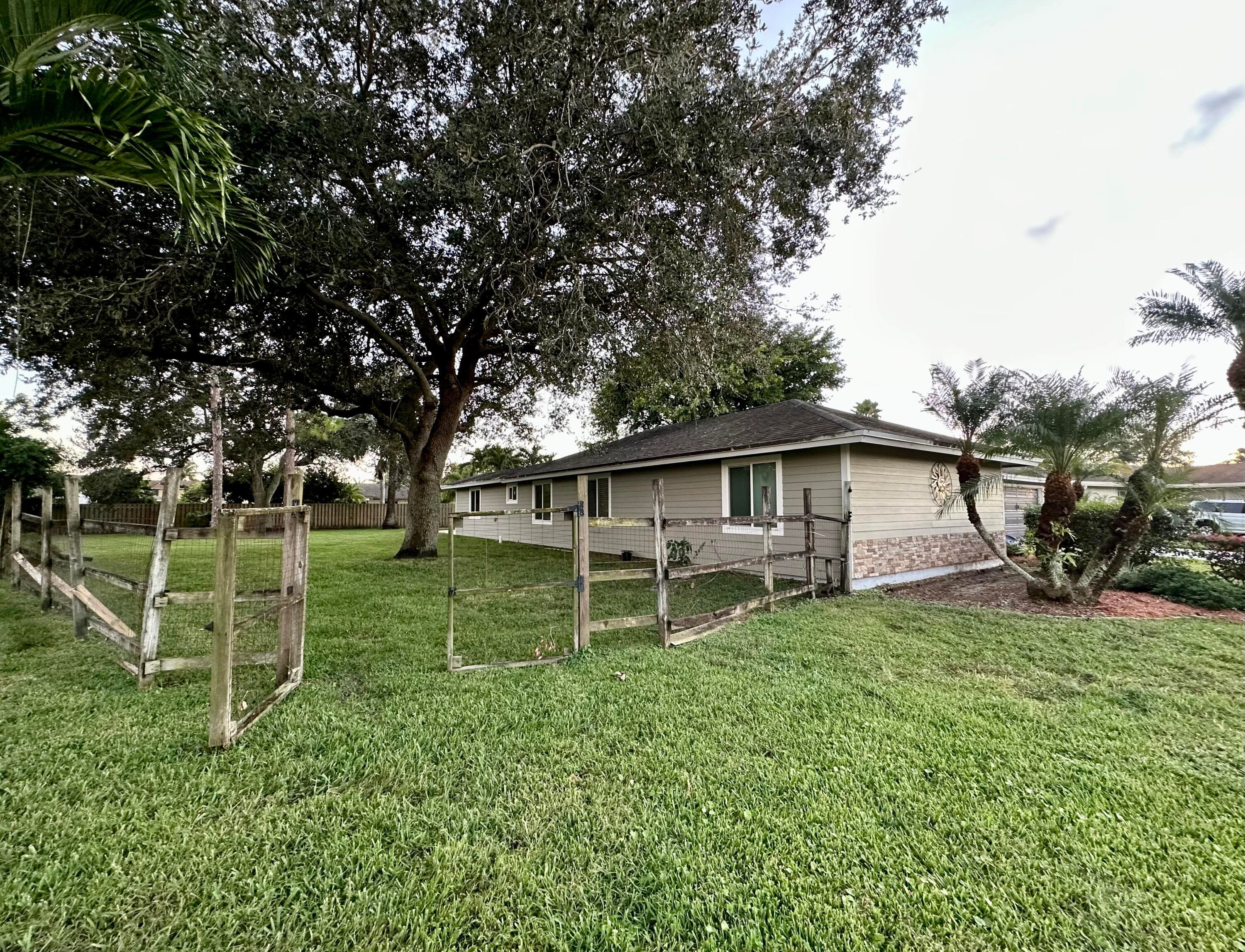 104 Segura Street, Royal Palm Beach, FL 33411 — photo 2 of 44