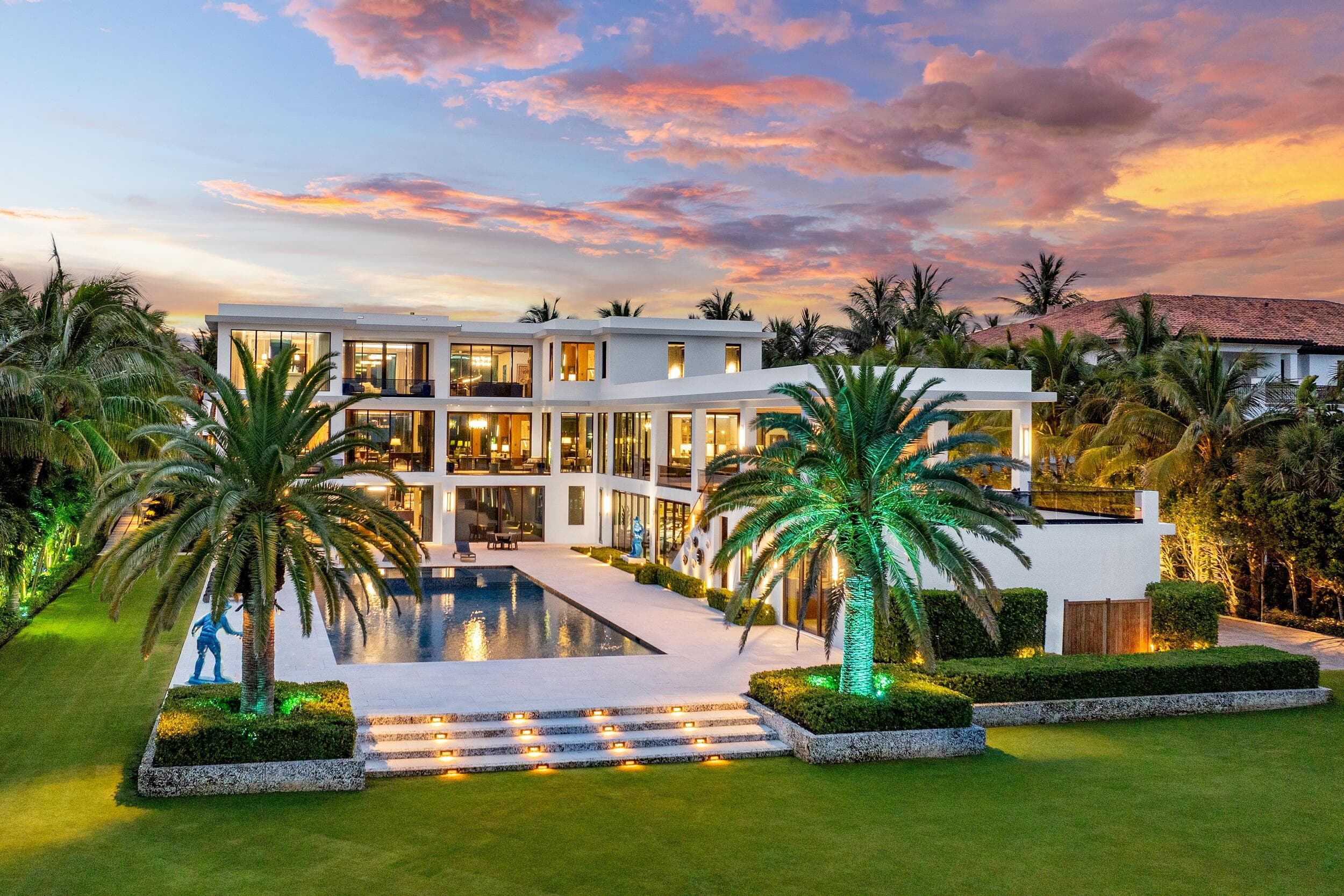 Ocean-to-lake estate at golden hour in Manalapan