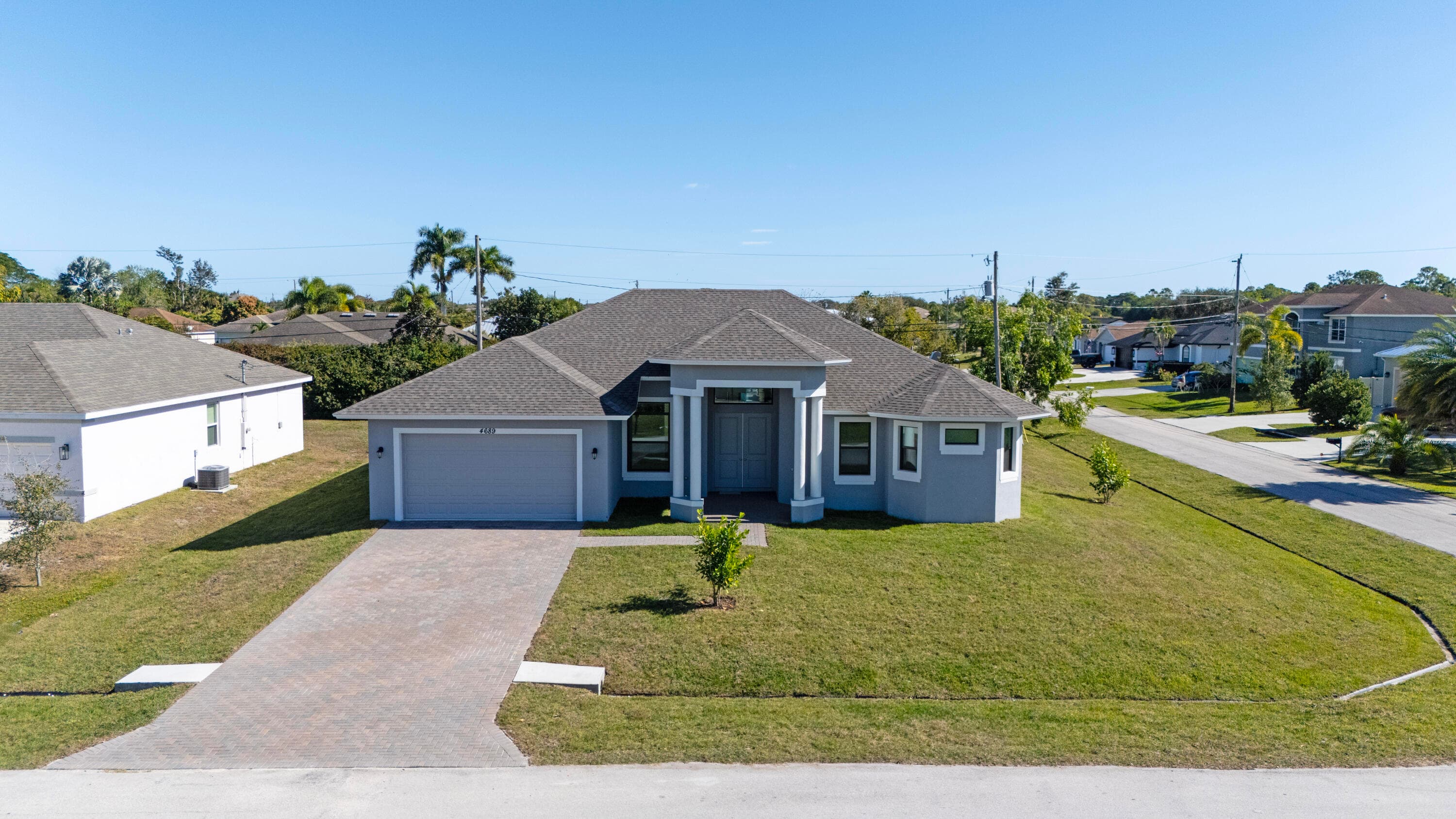 4689 SW Tacoma Street, Port St. Lucie, FL 34953 — photo 1 of 56