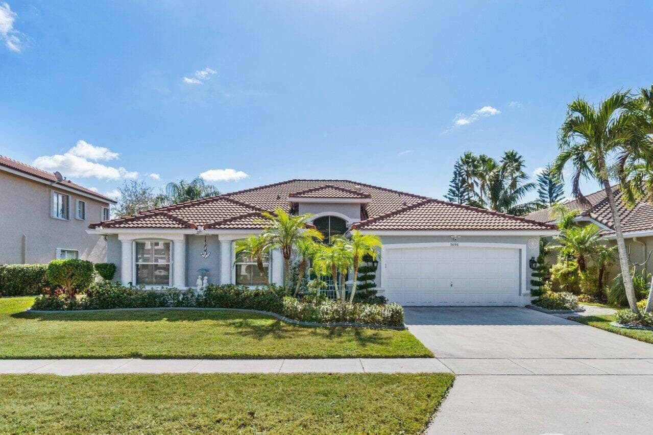 5696 Muirfield Village Circle, Lake Worth, FL 33463 — photo 1 of 55