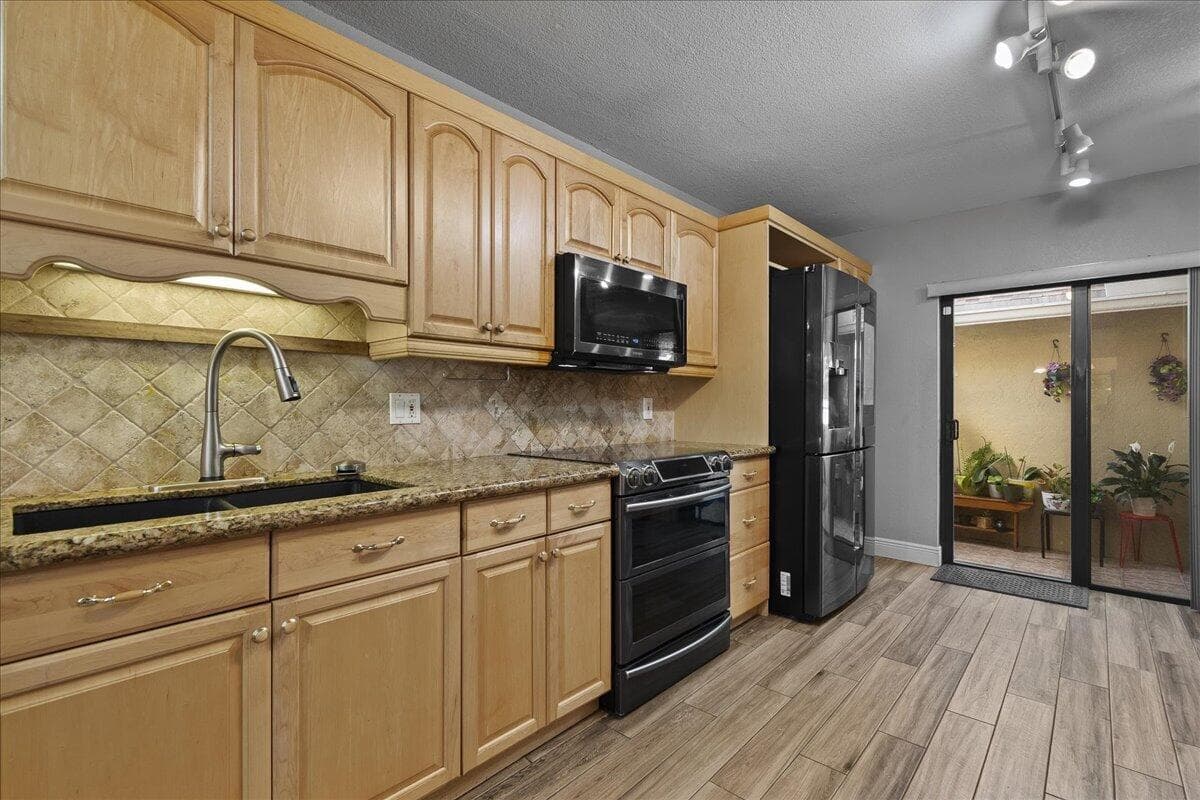 605 Maplewood Drive, Greenacres, FL 33415 — photo 2 of 20