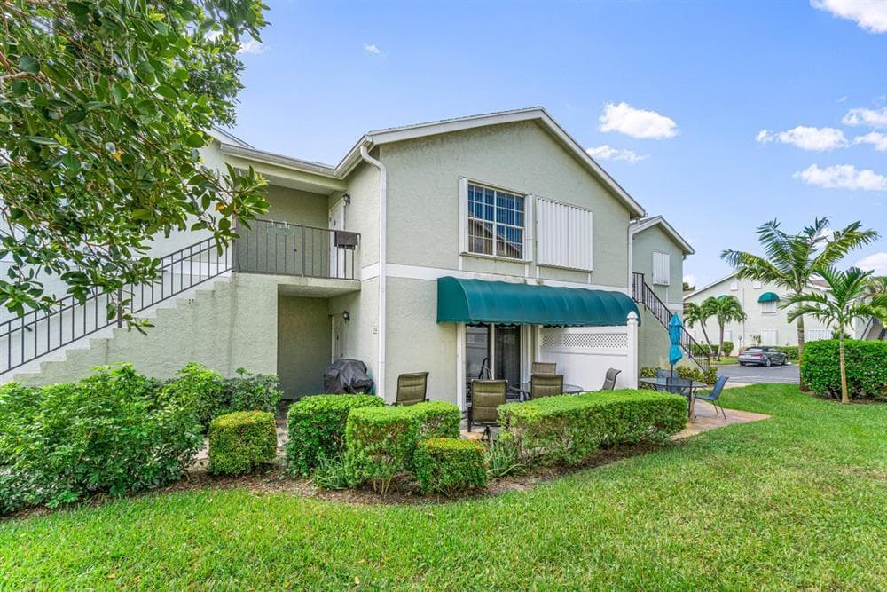 154 Waterside Drive 154, Hypoluxo, FL 33462 — photo 1 of 19