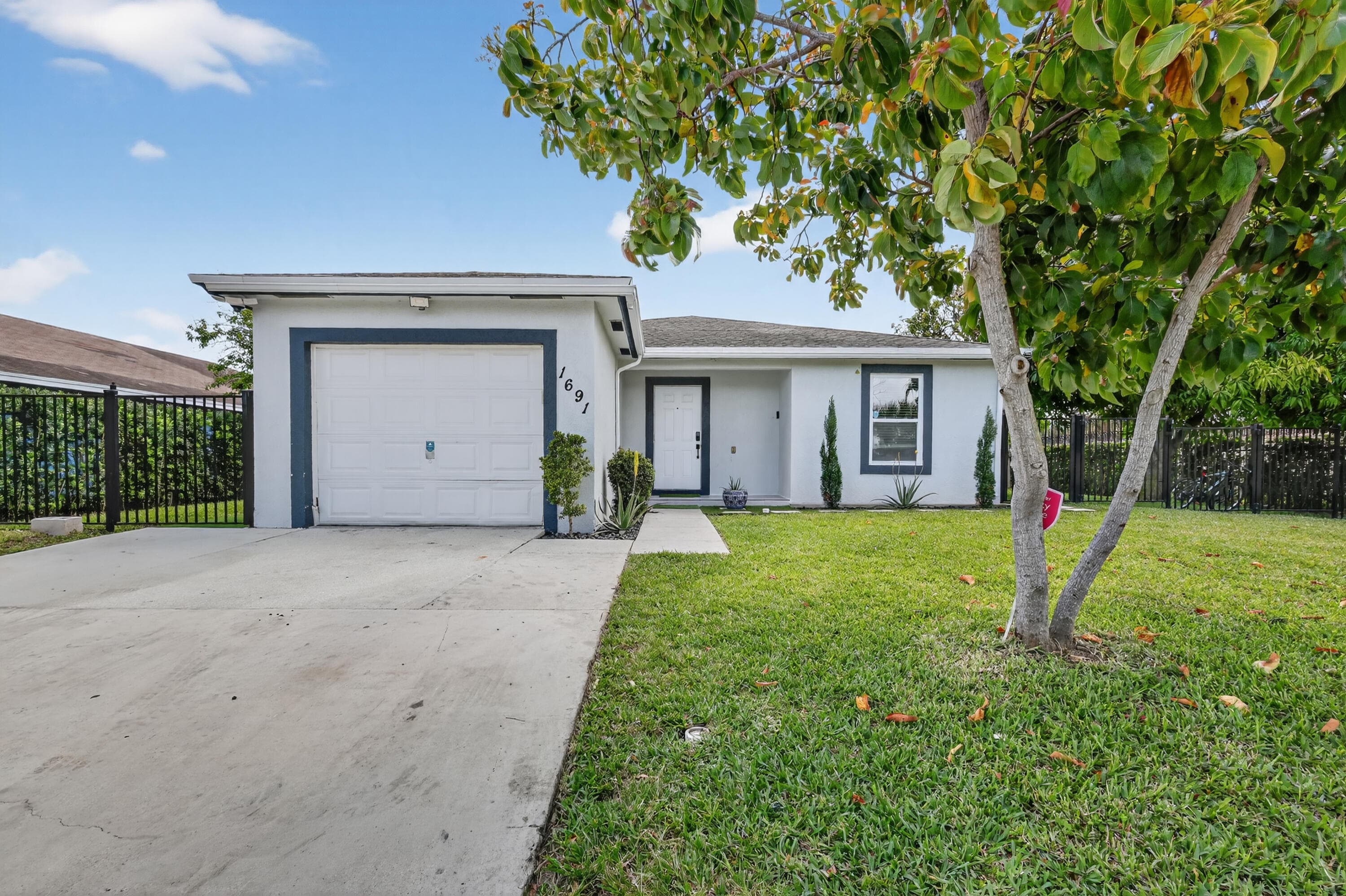 1691 W 26th Court, Riviera Beach, FL 33404 — photo 1 of 48