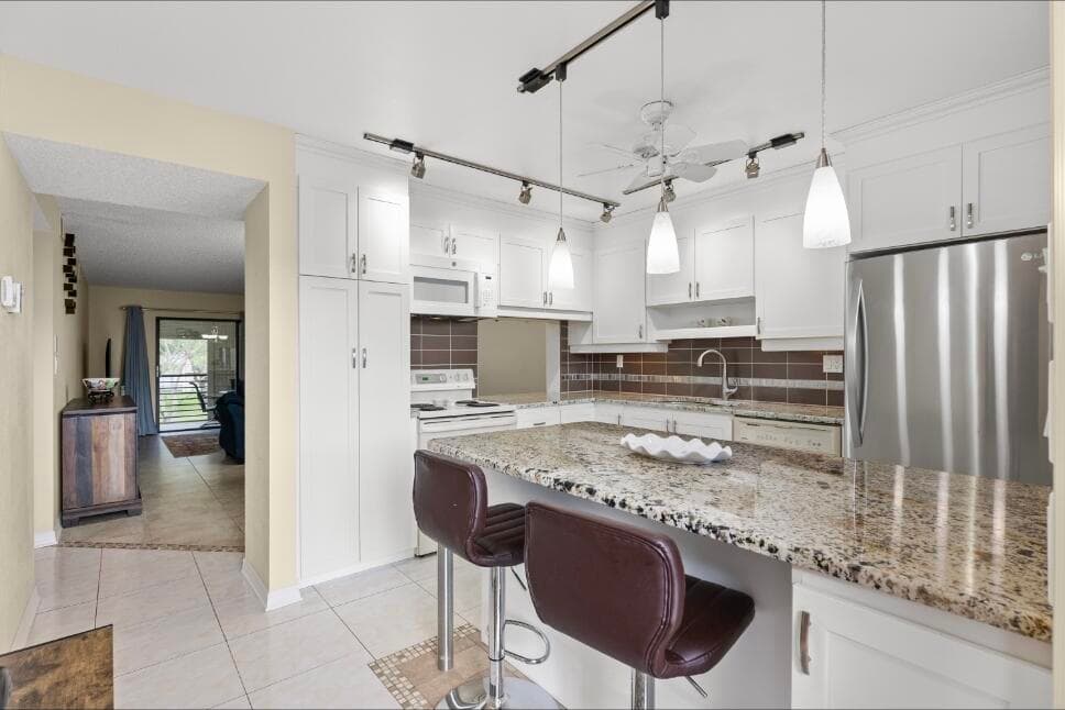 6095 N Sabal Palm Boulevard 210, Tamarac, FL 33319 — photo 1 of 23