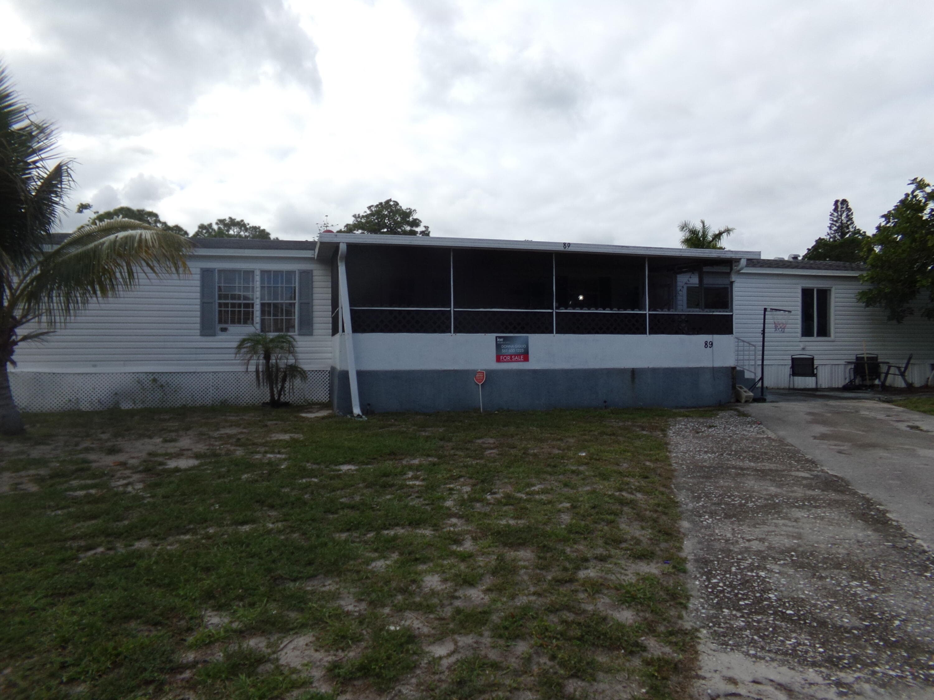 89 S Stuart Circle, Greenacres, FL 33463 — photo 1 of 16