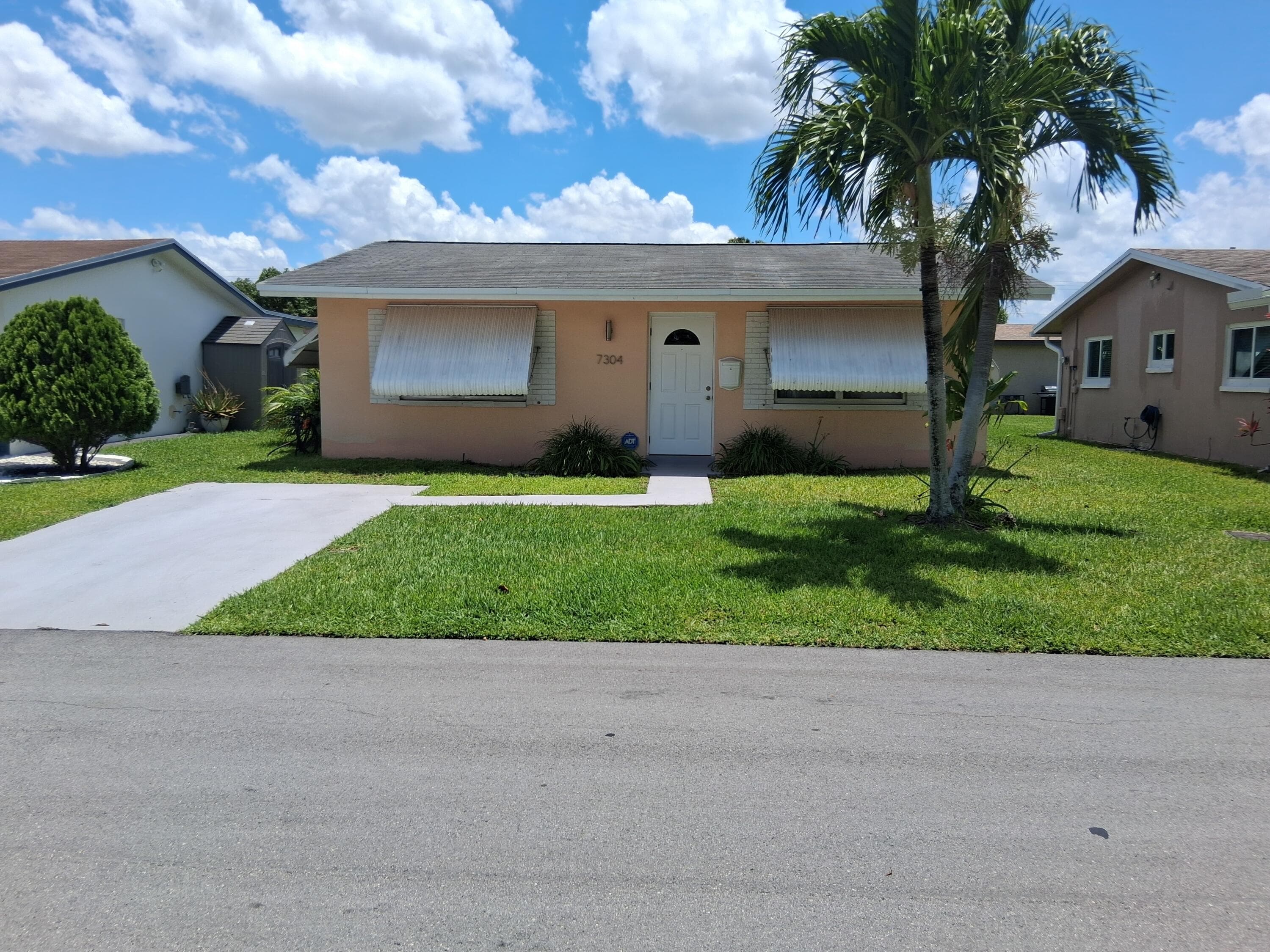 7304 NW 57th Drive, Tamarac, FL 33321 — photo 1 of 13