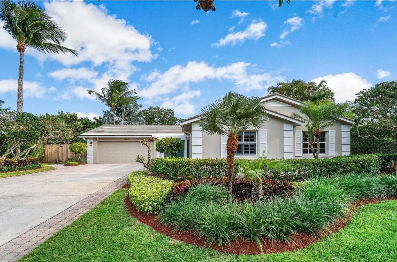 2436 Holly Lane NE, Palm Beach Gardens, FL 33410 — photo 1 of 57