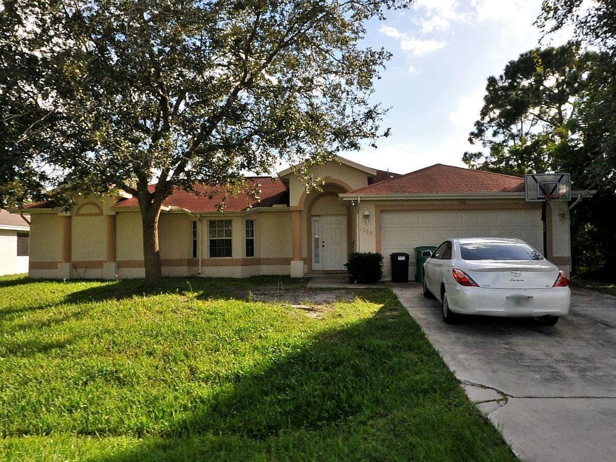 1238 SW Albenga Avenue, Port St. Lucie, FL 34953 — photo 1 of 2