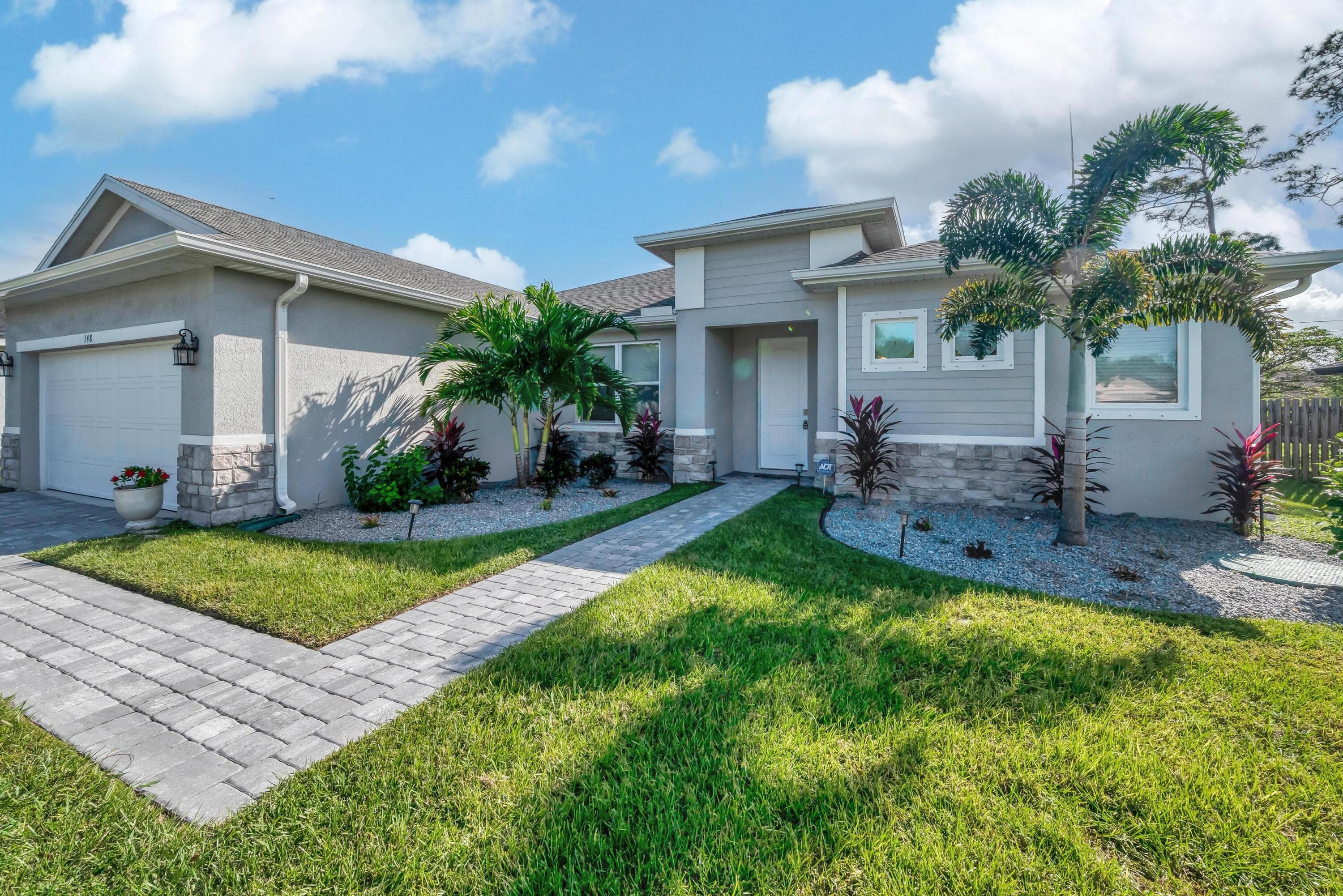 148 SW Sea Lion Road, Port St. Lucie, FL 34953 — photo 1 of 42