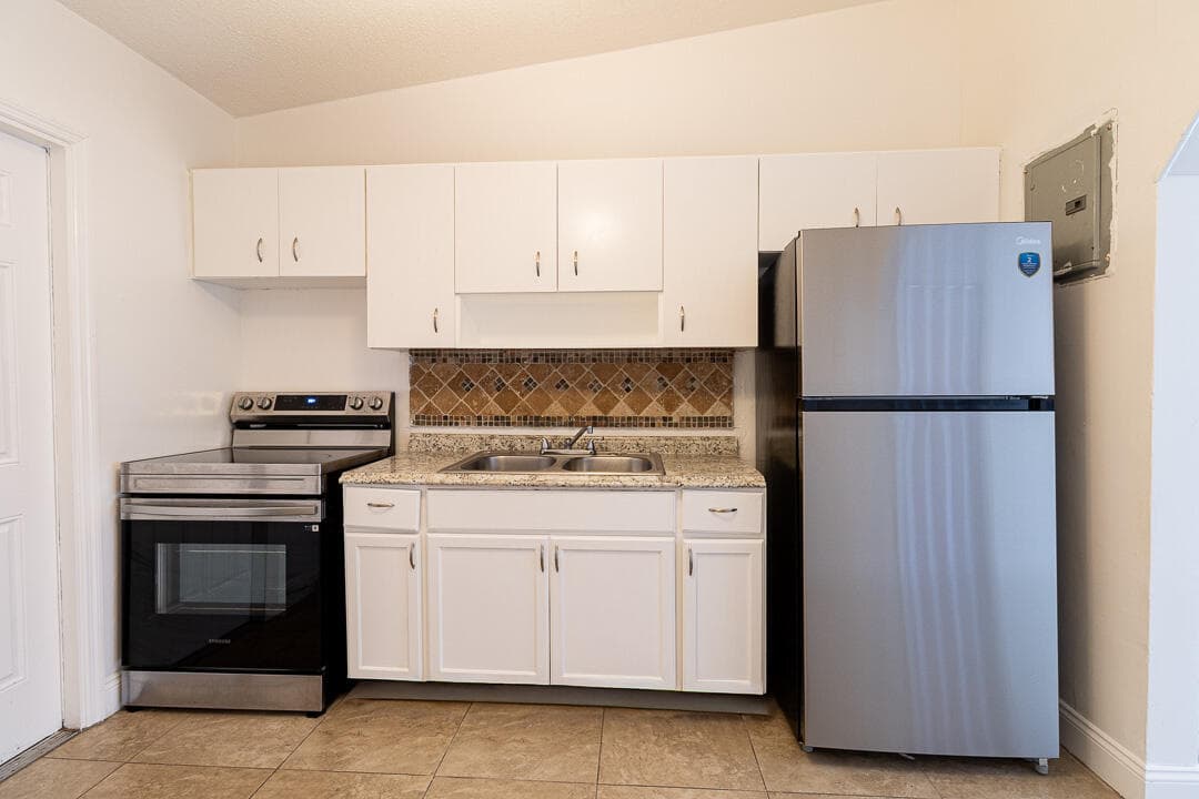 630 NW 15th Terrace 1-2, Fort Lauderdale, FL 33311 — photo 1 of 12