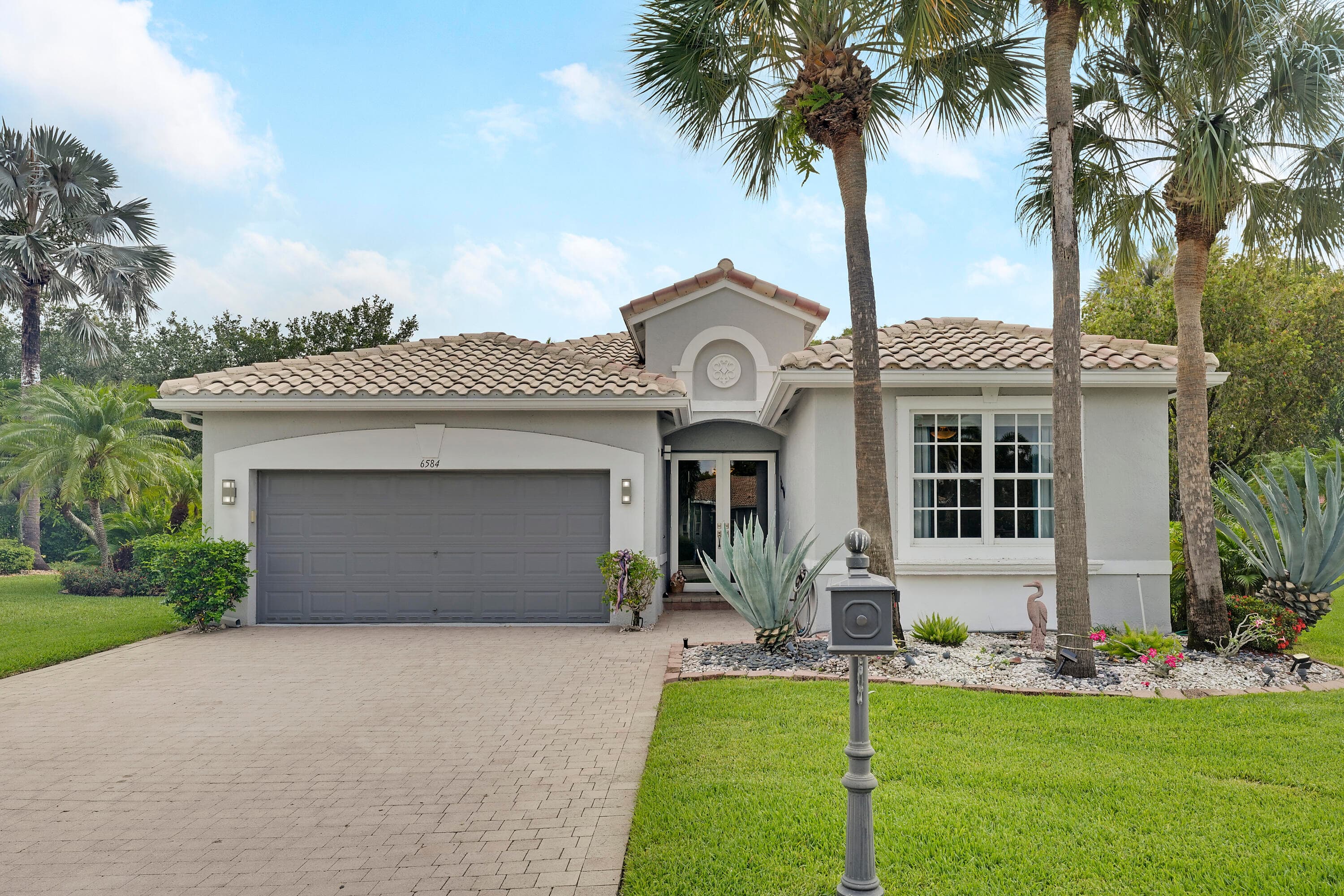 6584 Pavone Street, Lake Worth, FL 33467 — photo 1 of 70